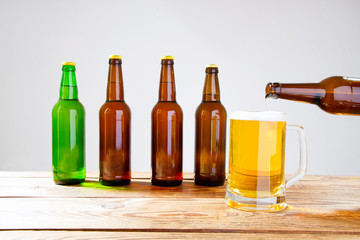 glass of beer on wooden table, top view. Beer bottles. Selective focus. Mock up. Copy space.Template. Blank.