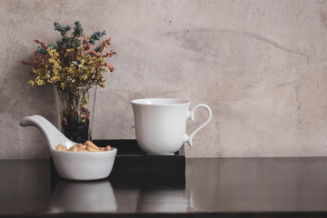 Coffee cup with flower in vintage style.