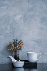 Coffee cup with flower in vintage style.