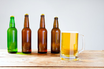glass of beer on wooden table, top view. Beer bottles. Selective focus. Mock up. Copy space.Template. Blank.