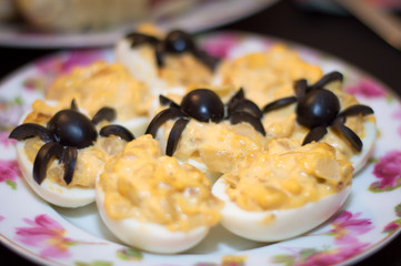 food for halloween with olive spider decoration