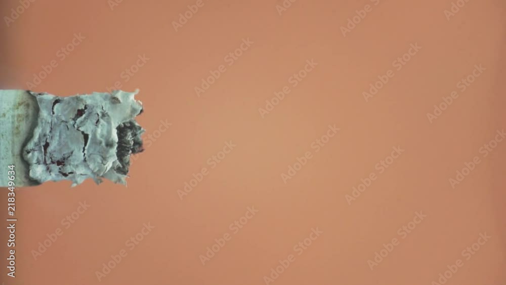 Poster cigarette on a yellow background macro view