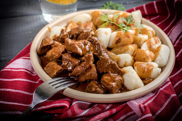 Beef stew with potatoes dumplings.