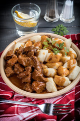 Beef stew with potatoes dumplings.