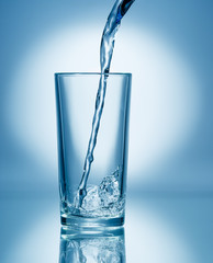 Pouring soda water into glass