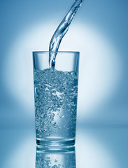 Pouring soda water into glass