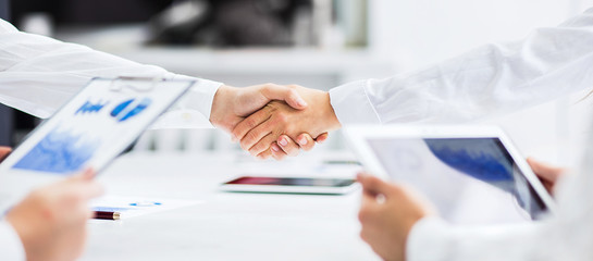 Business people shaking hands, finishing up a meeting