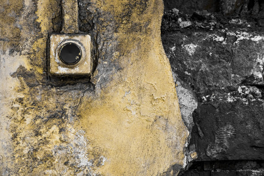 The old bell on the broken wall