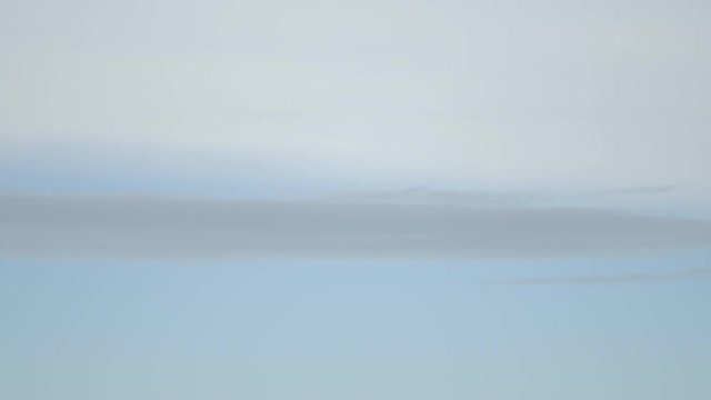 Grey cloud moves among two colour of sky