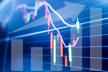 Stock market graph and candlestick chart for financial investment concept.