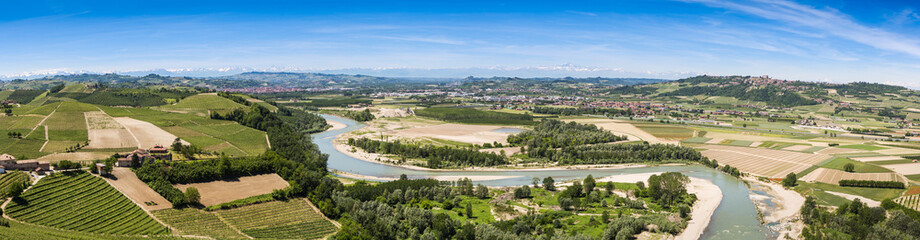 Piemontese landscape including the Tanaro river and the Alps shot from the tower of Barbaresco. The...