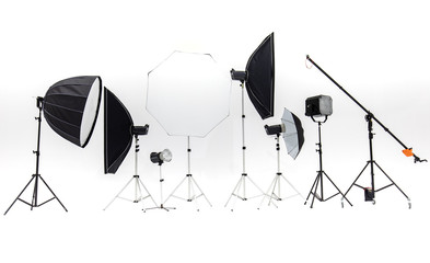 Flash studios of various sizes and accessories are placed together on  white background.