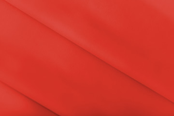 Smooth elegant shiny red silk or satin luxury cloth texture can use as abstract holidays background. Luxurious Christmas background or New Year background design.