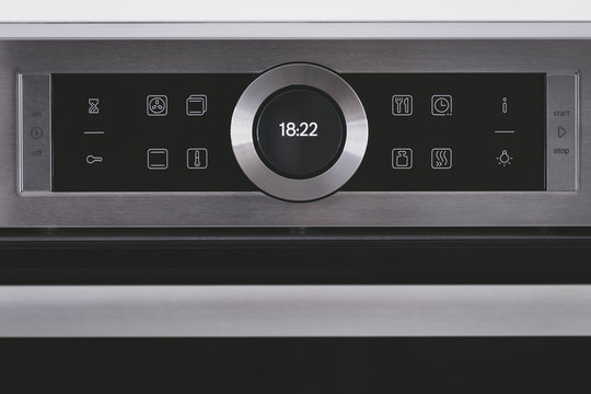 Steel modern touching panel of house electric oven.