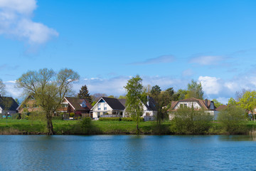 Naklejka na ściany i meble residential houses at a pond