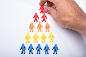Man Making Pyramid Of Human Figures