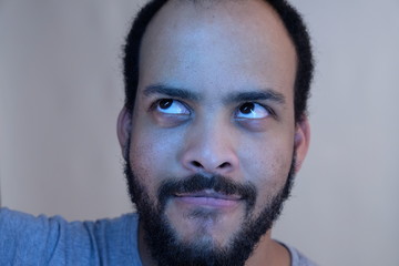 Bearded man portrait looking up