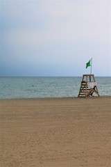 Empty Lifeguard Post on a Stormy  Sandy Beach