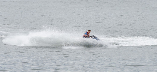 man is riding a hydrocycle