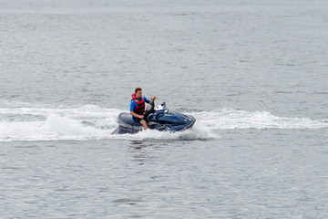man is riding a hydrocycle
