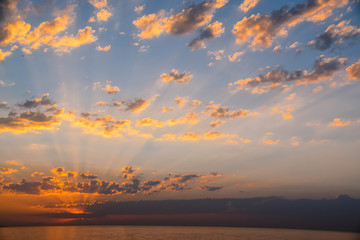 Background of colorful sky concept: Dramatic sunset with twilight color sky and clouds.