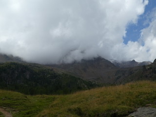 Fototapeta na wymiar summit rock of the mountains in italy south tyrol europe in the clouds