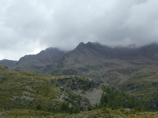 summit rock of the mountains in italy south tyrol europe in the clouds