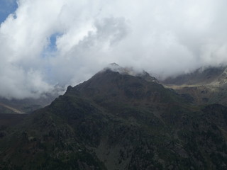 summit rock of the mountains in italy south tyrol europe in the clouds