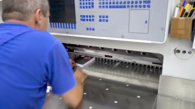 Printing factory - big industrial cutter for cutting paper shears - guillotine machine 4K.