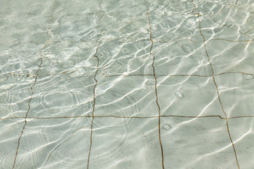 Waves and water splashes in the marble fountainWaves and water splashes in the marble fountain