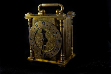 Vintage looking decorative clock with a black background