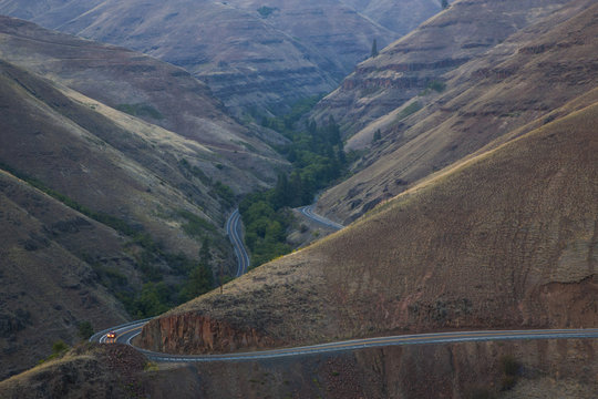 A view from above of a car on the highway in the Grande Ronde scenic area of eastern Washington State, USA
