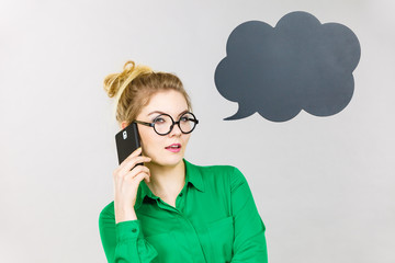 Business woman talking on phone with thinking bubble