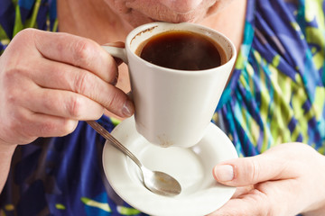 Senior woman drinking coffee