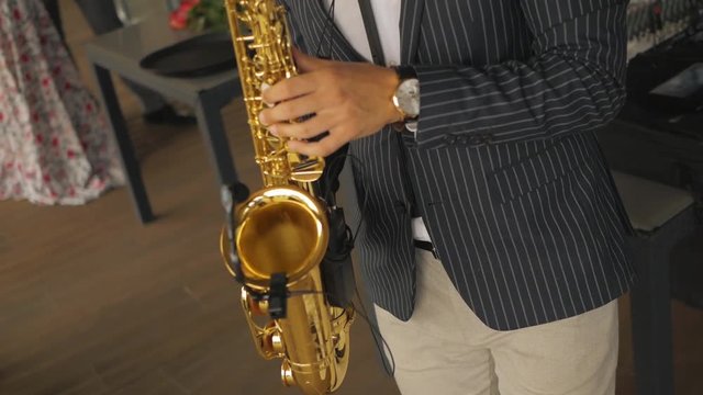 Saxophonist plays the saxophone