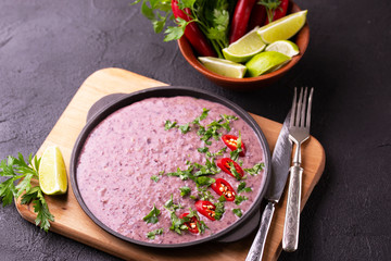 Mexican red bean puree soup with lime, parsley and chilli pepper.
