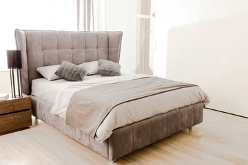 Foto op Aluminium interior of modern bedroom with soft grey bed © LIGHTFIELD STUDIOS