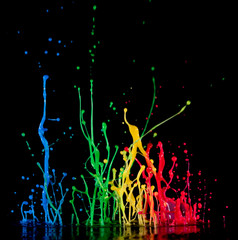 Splash of color ink on black background