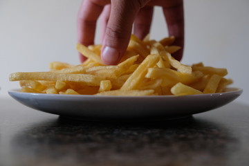 Fries on plate on counter