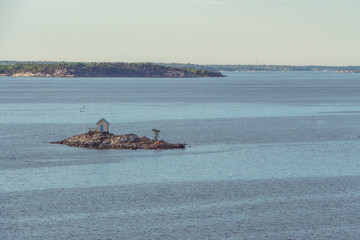 Obraz premium A lonely house on a separate tiny island.