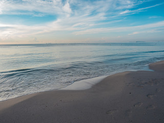 morning at the beach with smooth wave and blue sky
