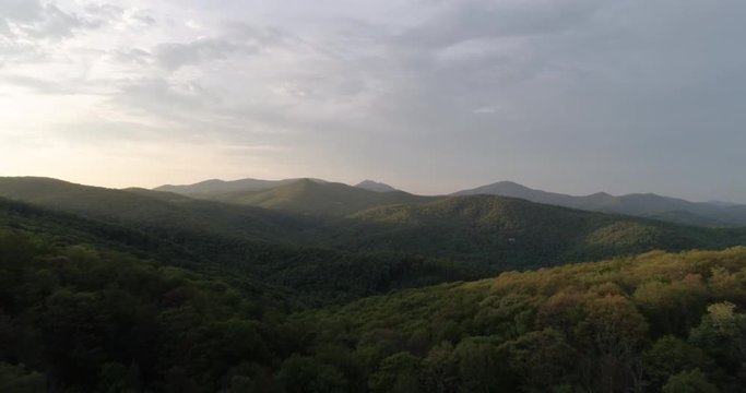 Drone footage over the blue ridge mountains at sunset.