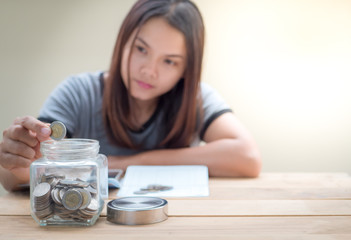 Women saving money for future.