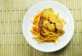 spicy stir fried bamboo shoot with pork ball curry on plate