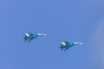 Two military fighter bomber aircraft in sky
