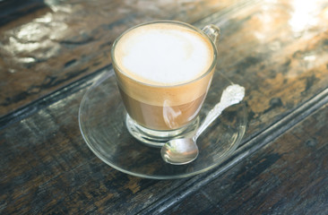 Hot coffee in white cup.