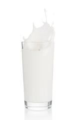 Splash of milk from glass on white background