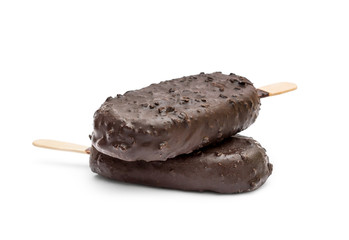 Stack of two chocolate ice creams on a stick on white background.