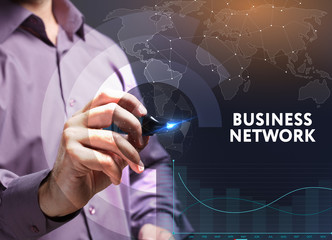 The concept of business, technology, the Internet and the network. A young entrepreneur working on a virtual screen of the future and sees the inscription: business network