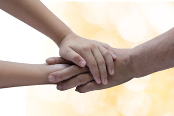 .Caregiver, carer hand holding elder hand in hospice care. Philanthropy kindness to disabled old...